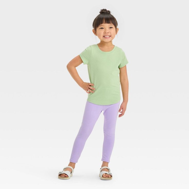 This Short-Sleeve Solid T-Shirt from Cat & Jack™ makes a great casual wardrobe staple for your little one. Tailored in a relaxed fit, this short-sleeve T-shirt is crafted from lightweight fabric for all-day cool comfort, while the below-hip length makes it easy to wear either tucked in or untucked. Designed in a solid hue, this crewneck tee makes an easy pairing with various pants, shorts or skirts for versatile outfit options. Cat & Jack™: Kids’ clothing with an imagination of its own. Green Relaxed Fit Tops For Playwear, Relaxed Fit Green Tops For Playwear, Playful Stretch Crew Neck Top, Playful Solid Color Tops For Playwear, Playful Short Sleeve Top, Basic Spring Playwear Tops, Basic Tops For Playwear In Spring, Basic Spring Tops For Playwear, Stretch Crew Neck Tops For Playwear