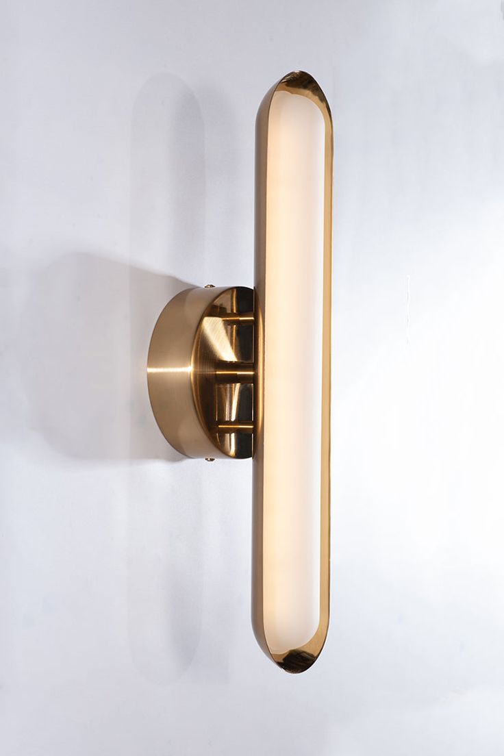 a close up of a wall light on a white wall with no one in it