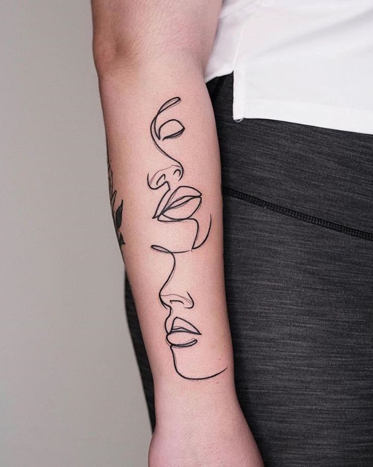 a person with a tattoo on their arm