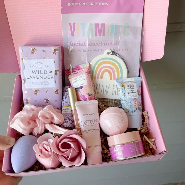 a pink box filled with lots of beauty products