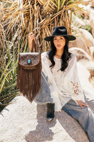 World Traveler with Turquoise Pendant Bohemian Crossbody Saddle Bag, Turquoise Crossbody Travel Bag, Turquoise Crossbody Bag For Travel, Turquoise Leather Satchel For Travel, Bohemian Crossbody Saddle Bag For Everyday Use, Bohemian Saddle Shoulder Bag For Travel, Brown Bohemian Bag For On-the-go, Bohemian Saddle Bag With Adjustable Strap, Bohemian Satchel Saddle Bag For Travel