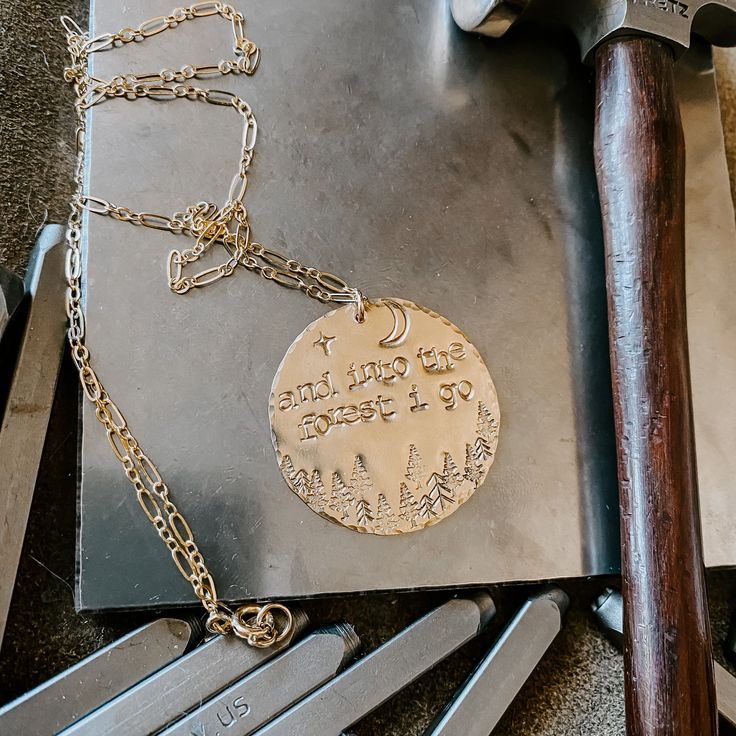 Hand stamped and hammered medallion with the cutest woodsy vibe. This Medallion is over twice the size of our 19mm large coin necklace, measuring approximately 1 1/4" in diameter. Available in 14k gold fill or sterling silver. Large medallion coin, 18" or 20” chain length available. If you would prefer a different chain length, please leave an order note at checkout. Into The Forest, Ear Jacket Earring, Earring Jackets, Tourmaline Earrings, Medallion Necklace, Coin Necklace, The Forest, Chain Lengths, Chain Length