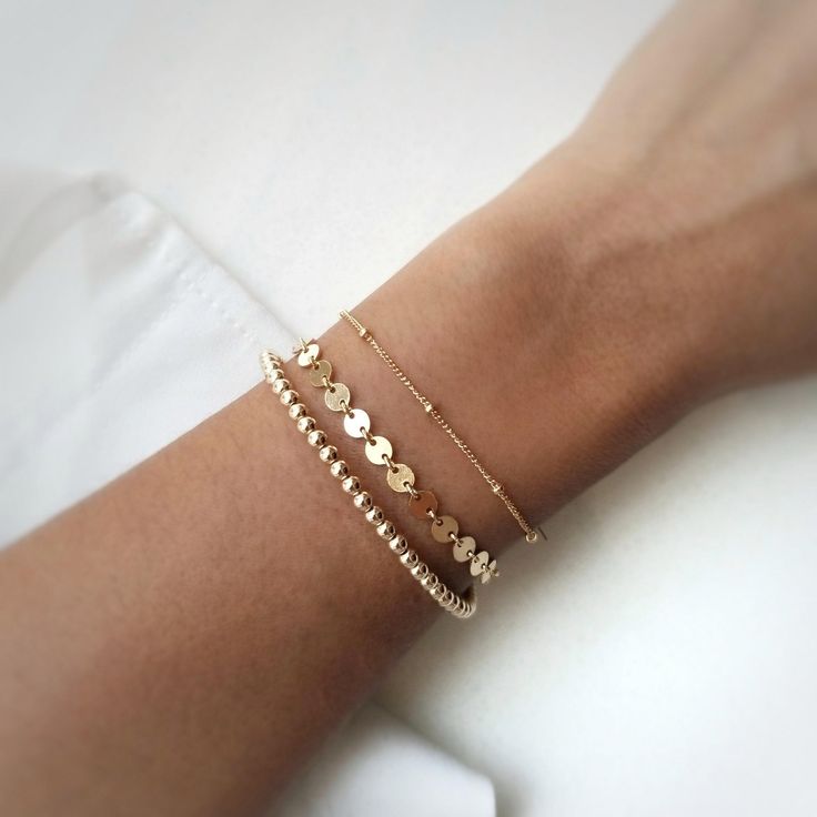 Handmade in Toronto, Canada Perfect on its own or as a bracelet stack. No need to take it off as it's 14k gold plated and water resistant. Length: 6.5" plus a 1" extenderCoins measure 4mm diameter Trendy Gold Stackable Stretch Bracelet, Everyday Resizable 14k Gold Filled Jewelry, Trendy Resizable Gold Jewelry, Trendy Adjustable Tarnish Resistant Gold Bracelet, Trendy Adjustable 14k Gold Bracelet, Trendy Stackable Gold-plated Bracelets, Adjustable Minimalist 14k Gold-filled Charm Bracelet, Adjustable 14k Gold Filled Minimalist Charm Bracelet, Adjustable 14k Gold-filled Bracelet