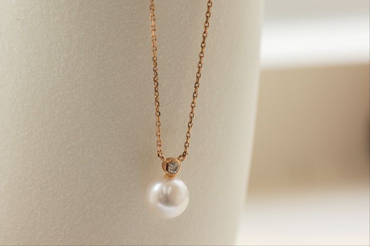 A combination of two birthstones for April (diamond) and June (pearl), the Saltwater Pearl & Diamond Necklace is a finishing piece for any classy occasion. Pairing suggestion:Saltwater Pearl & Diamond EarringsDimensions:Chain length: 40 cm, adjustable up to 42 cm (approx. 15.7 to 16.5 in) Materials used (pictured):14K solid rose gold, 1.44 g1 x saltwater pearl, 7 mm1 x champagne diamond, 0.1 ct Timeless Pear-shaped Wedding Necklace, Pearl Briolette Jewelry For Anniversary, Elegant Pear Shaped Necklace With Diamond Accents, Elegant Pear-shaped Necklace With Diamond Accents, Elegant Diamond Necklace With Birthstone, Delicate Diamond Jewelry With Pearl Drop, Wedding Pearl Necklace With Gemstone, Minimalist Pear-shaped Diamond Jewelry, Timeless Wedding Necklace With Birthstone