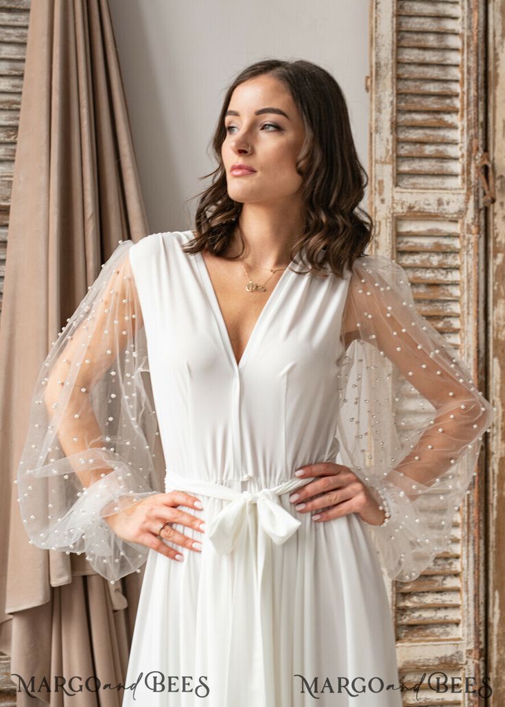 Sheer V-neck Wedding Gown, Bridesmaid Gown With Long Lace Sleeves, Long Sleeve Bridesmaid Gown With Lace Sleeves, Chic Wedding Dress With Sheer Sleeves, Elegant Dresses With Lace Sleeves For Wedding Night, Elegant Sheer Robe For Party, Elegant Wedding Night Dress With Lace Sleeves, Elegant Gown For Wedding Night And Spring, Elegant Spring Gown For Wedding Night