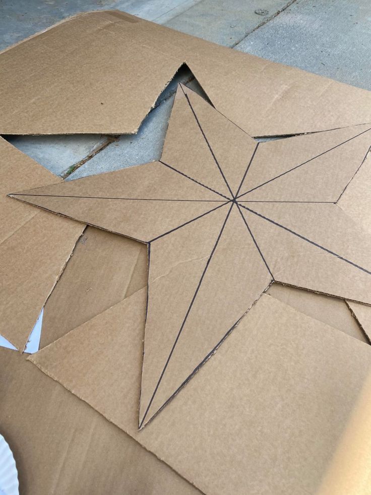 a cardboard star cut out on the ground