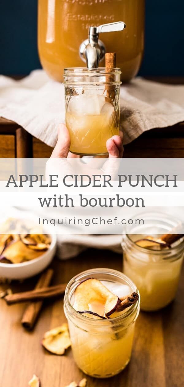 apple cider punch with bourbon in mason jars on a wooden table next to cinnamon sticks