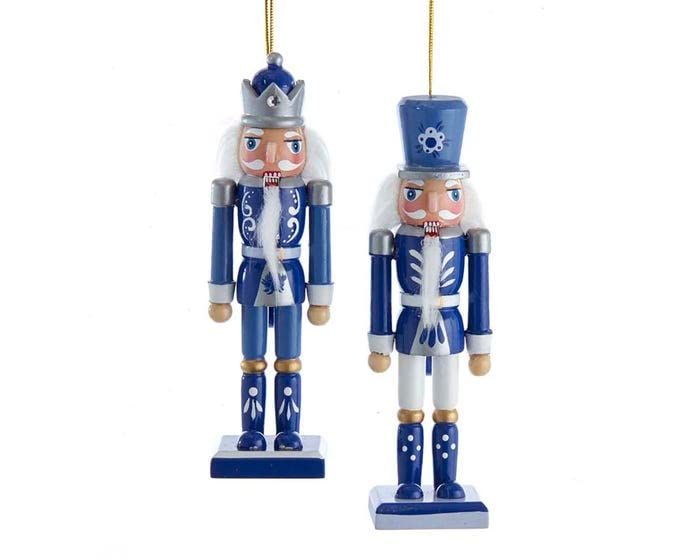 two blue and white nutcrackers are hanging from the ceiling in front of a white background