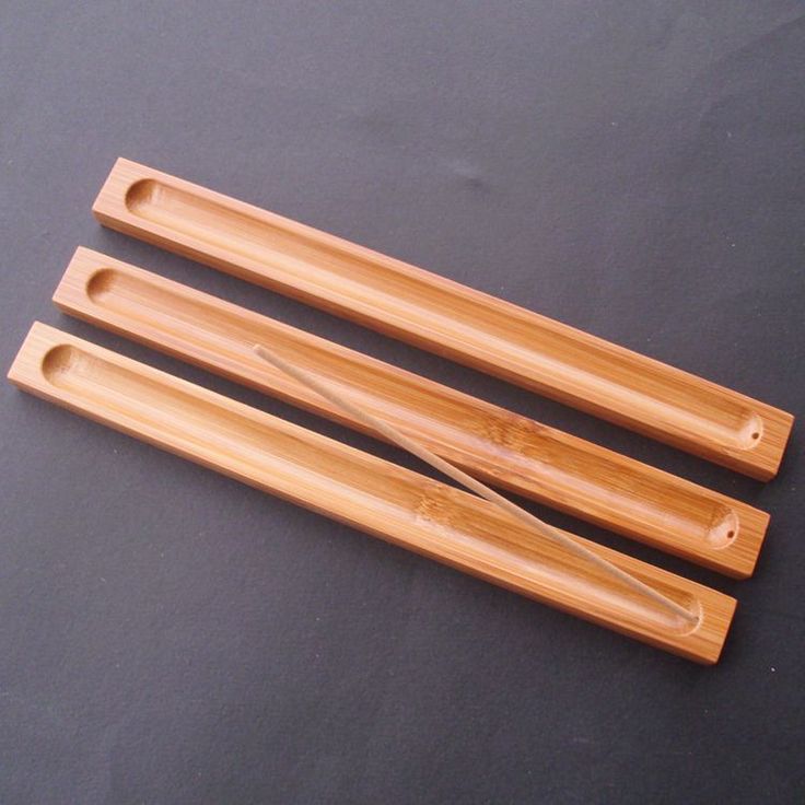 Our bamboo stick incense holder features an elegant and minimal design that can easily be added to any commercial or private space. It's easy to fit and compact size will sit on any desk or shelf without creating any distraction. So you can keep up with a soothing and calming sense. Its innovative design helps keep a calming presence while doubling as an ash container for the incense holder. This helps ensure that there is no mess, and any chances of an accident can easily be avoided. Offering you a truly useful and effective design that helps add character in style, while ensuring safety at all times. Additionally, the incense holder is carefully crafted using bamboo wood that is laced with a protective finish. This helps add a subtle charm and keeps your wood incense holder in perfect sh Stick Incense, Incense Burner Holder, Bamboo Material, Incense Sticks Holder, Wood Product, Incense Holders, Recycled Art, Decorative Panels, Back To Nature