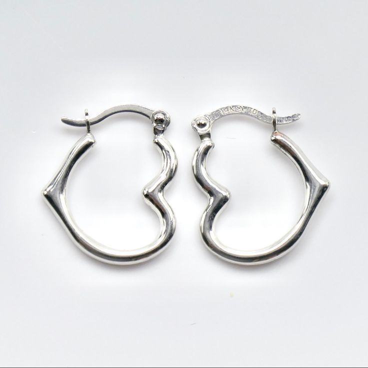 Beautiful Pair Of Heart Shaped Hoop Earrings. They Are 14k White Gold, Stamped On The Posts. The Earrings Measure 15mm Long Or 5/8ths Of An Inch. They Weigh .45 Grams. Brand New, Great Gift! Heart Charm Small Hoop Jewelry For Anniversary, Small Hoop Jewelry With Heart Charm For Anniversary, Hypoallergenic Sterling Silver Hoop Earrings For Anniversary, Sterling Silver Small Hoop Huggie Earrings For Anniversary, Sterling Silver Huggie Earrings For Anniversary, Nickel-free Huggie Earrings For Anniversary, Sterling Silver Heart-shaped Huggie Earrings, Sterling Silver Heart Shaped Huggie Earrings, Silver Huggie Earrings For Anniversary