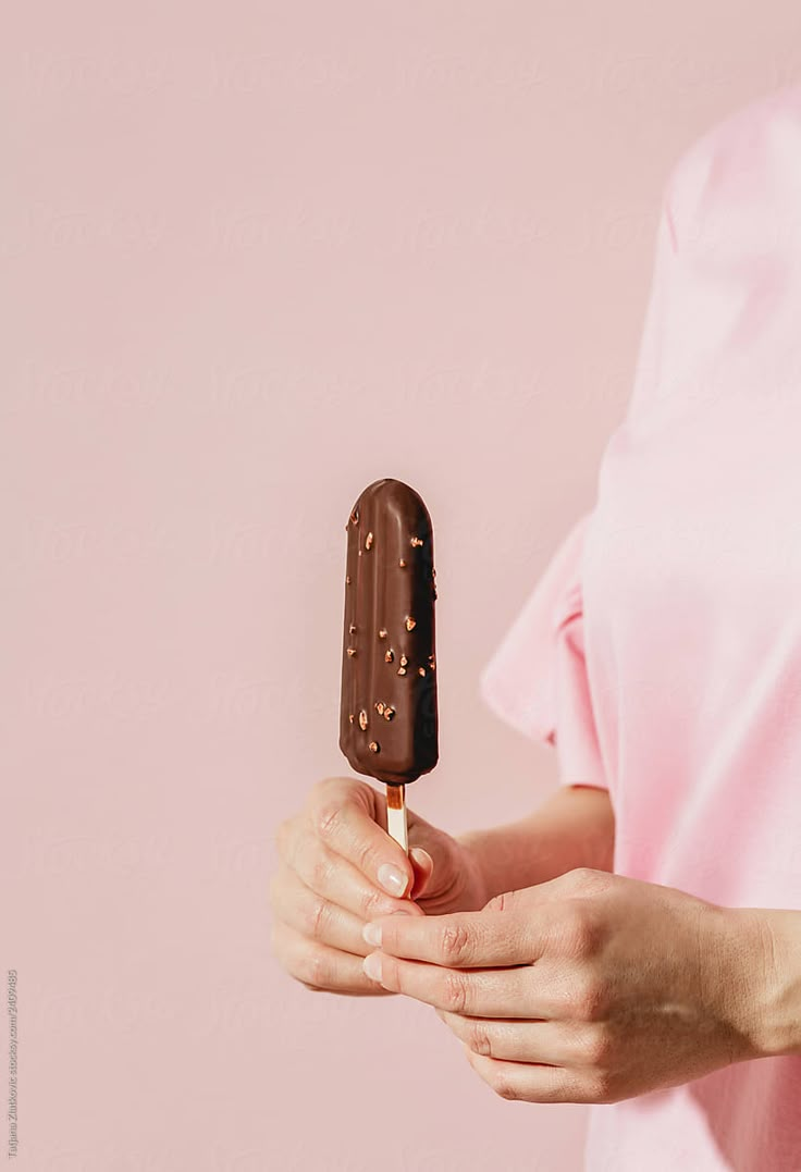 a woman holding an ice cream bar in her hands by luma studio for stocks on artfire