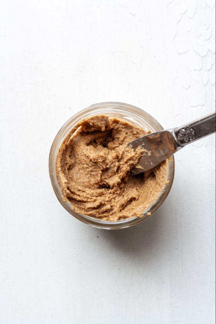 a small glass bowl filled with peanut butter