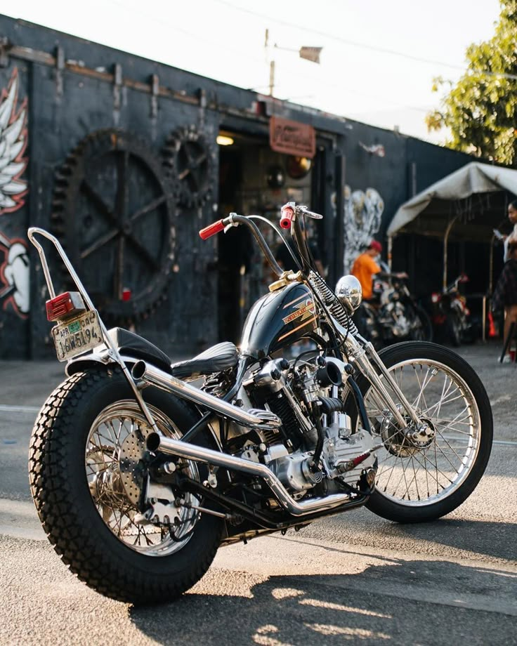 the motorcycle is parked on the side of the road