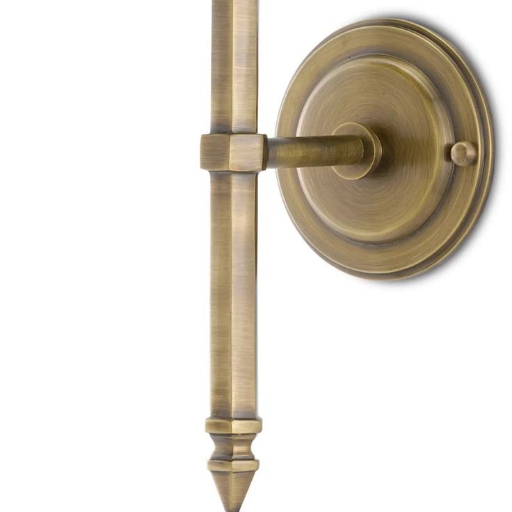 an old fashioned brass door handle on a white background