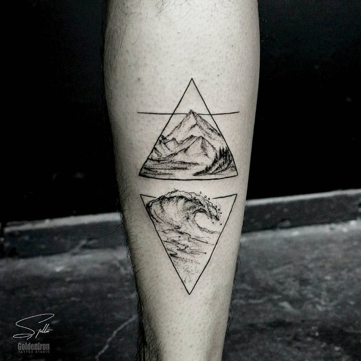 a man's leg with three mountains and waves tattoo on the left side of his calf