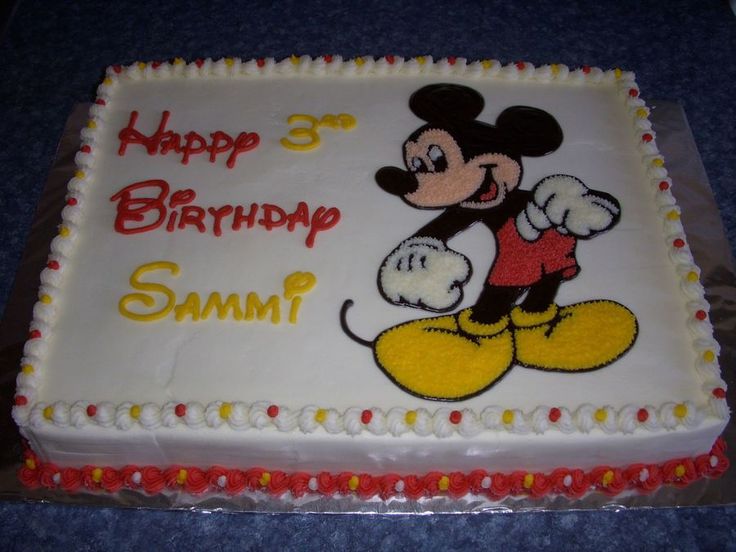 a birthday cake with a mickey mouse on it