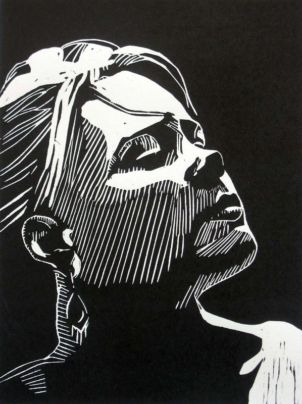 a black and white drawing of a woman's face with her hair pulled back