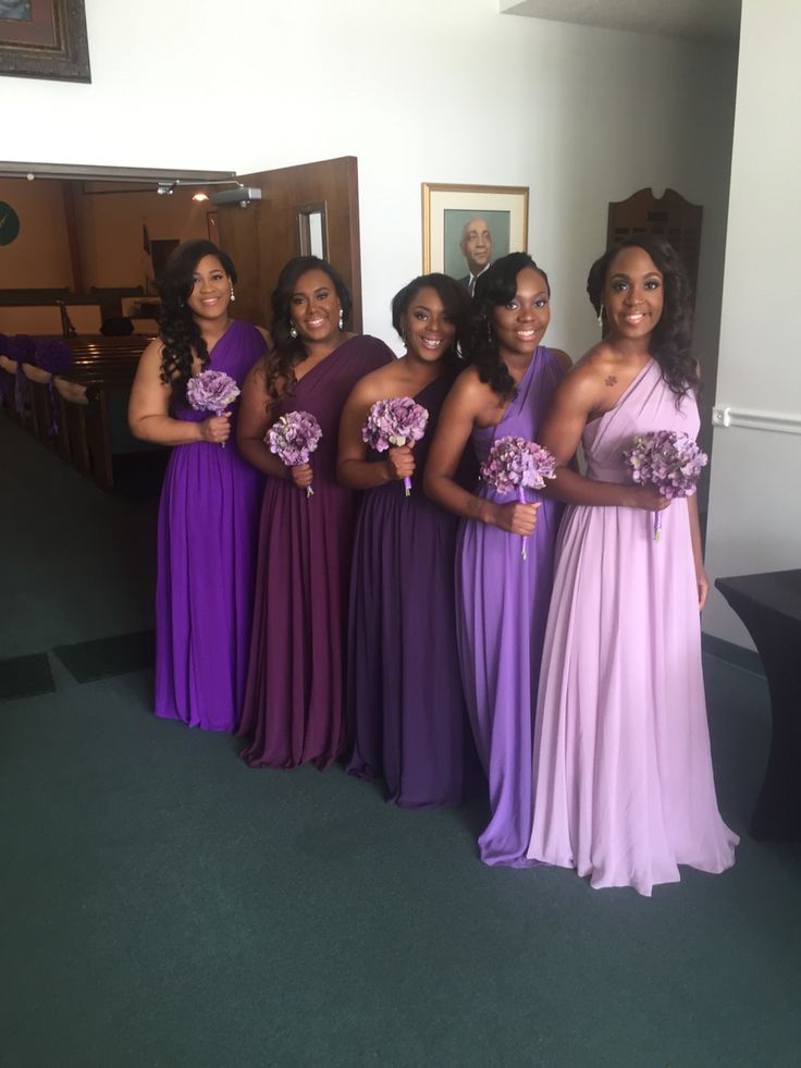 the bridesmaids are all dressed in purple and lavender dresses for their wedding ceremony