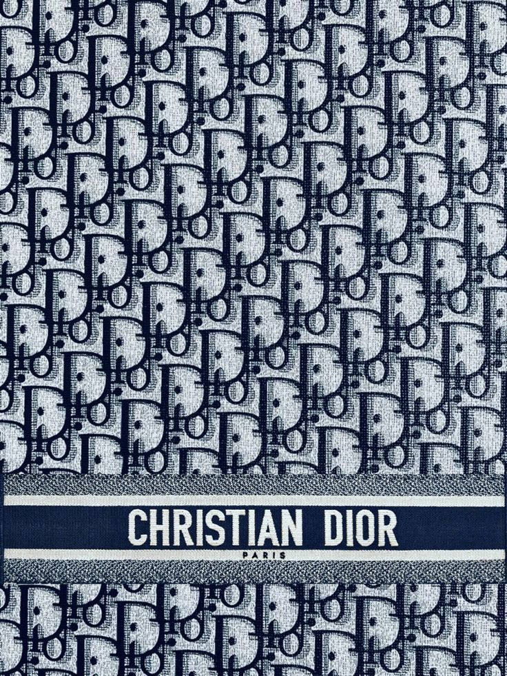 a blue and white pattern with the words christian dior on it's side