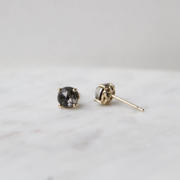 14k Yellow Gold 6mm Round Black Night Quartz Post Earrings ~ Suzanne Kalan designs stunning fine jewelry that is both innovative and unique. These custom-cut gemstones sparkle from every angle. The back of the earring has filigree detailing which allows light to shine through. 14k yellow gold 6mm prog set black night quartz Post ear wire Handcrafted in California Shop the Collection Shop the Collection Learn more about Suzanne Kalan Black Diamond Earrings Gift, Black Diamond Earrings As Gift, Gift Black Diamond Earrings, Black Night, Suzanne Kalan, Blackest Night, To Shine, Ear Wire, Post Earrings