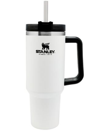 a white travel mug with a black handle and the name stanley on it's side