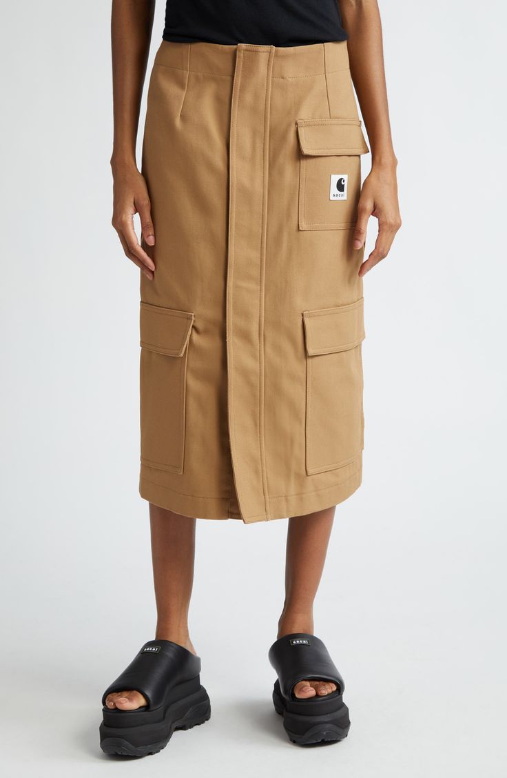 The iconic Japanese label and the American workwear brand team up again to offer everyday styles like this cargo skirt crafted from durable cotton canvas. 30 1/2" length (size 4) Front slant pockets; cargo pockets Unlined 100% cotton Dry clean or machine wash, dry flat Made in Japan Designer Clothing Cotton Workwear Skirt With Multiple Pockets, Cotton Work Skirt With Multiple Pockets, Utility Cotton Cargo Skirt, Fall Utility Cargo Skirt With Patch Pockets, Utility Cotton Skirt With Patch Pockets, Fall Utility Cargo Skirt With Pockets, Cotton Cargo Skirt With Patch Pockets For Work, Cotton Utility Skirt With Patch Pockets, Utility Skirt With Pockets For Work