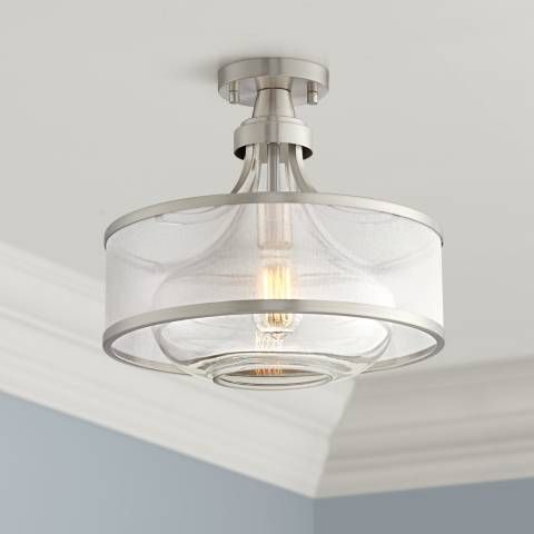 a light fixture in a room with white walls