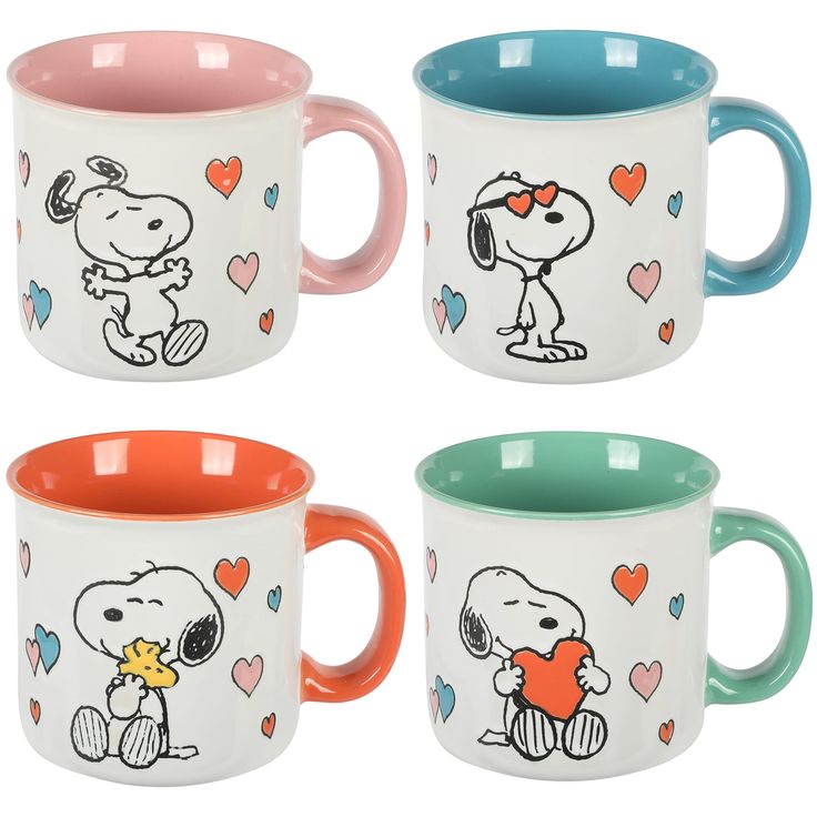 four coffee mugs with cartoon characters painted on the inside and outside of each cup