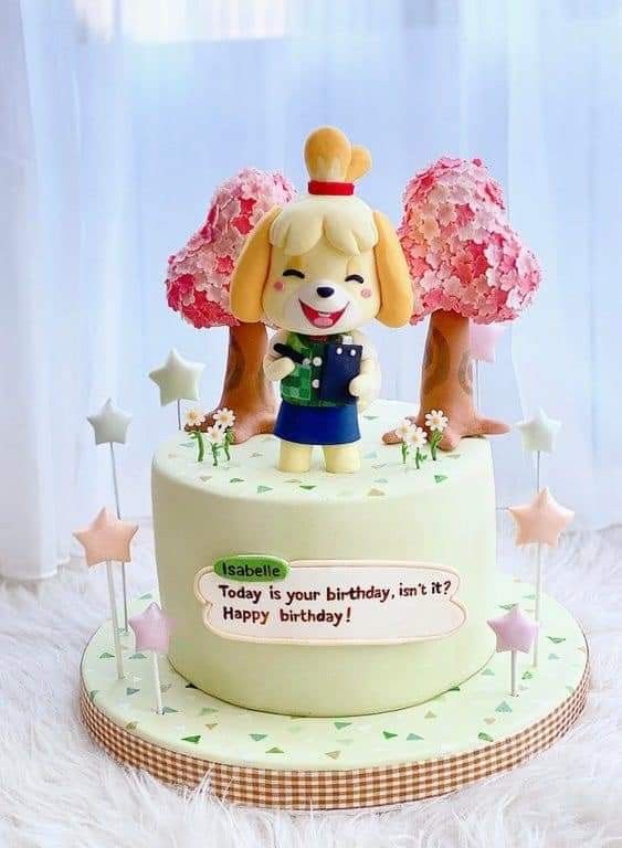 a birthday cake with a dog on top