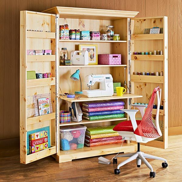 an open bookcase with sewing supplies on it