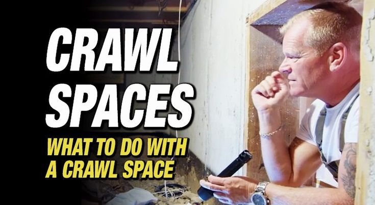 a man is looking at his cell phone while he sits in front of a wall with the words crawl spaces on it