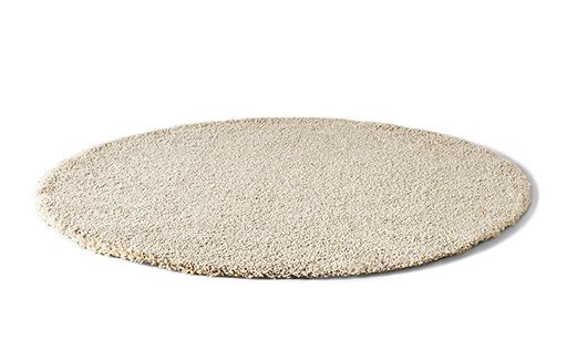 a white round rug on a white background