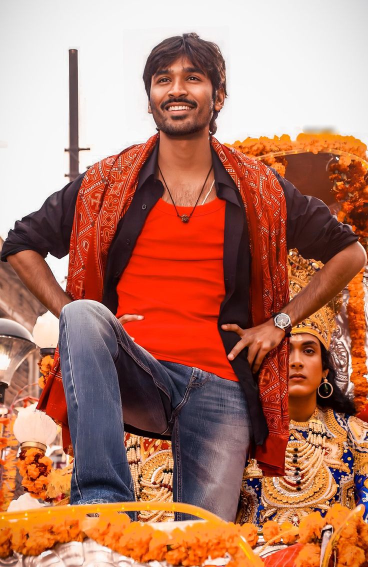 a man sitting on top of a float in the street