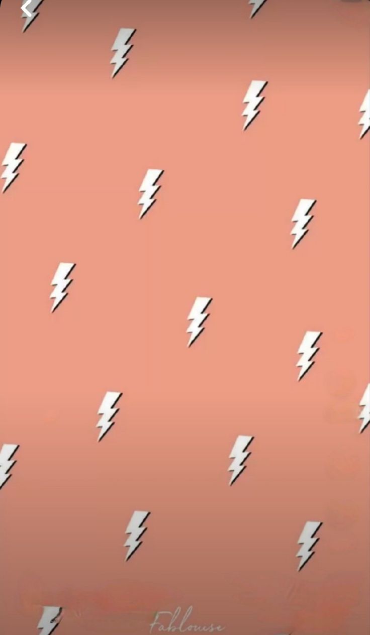 a pink background with white lightning bolts