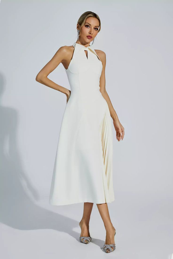 Crafted with meticulous attention to detail, Cynthia Cream Ruched Midi Dress is a must-have for the fashion-forward individual. This sleeveless waist pleated dress exudes elegance and sophistication. Featuring a stylish cut-out lapel design, this dress is perfect for any occasion, be it formal or casual.   Dress Length: Approx 124cm Materials: Polyester Gentle Dry Clean Only  The model is 5 ft 74 and wears size S  Color may vary due to lighting on images. The product images (without a model) are Lapel Design, Ruched Midi Dress, Product Images, Pleated Dress, Dress Length, Fashion Forward, Casual Dress, Cut Out, Dry Clean