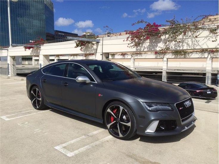 a grey car parked in a parking lot