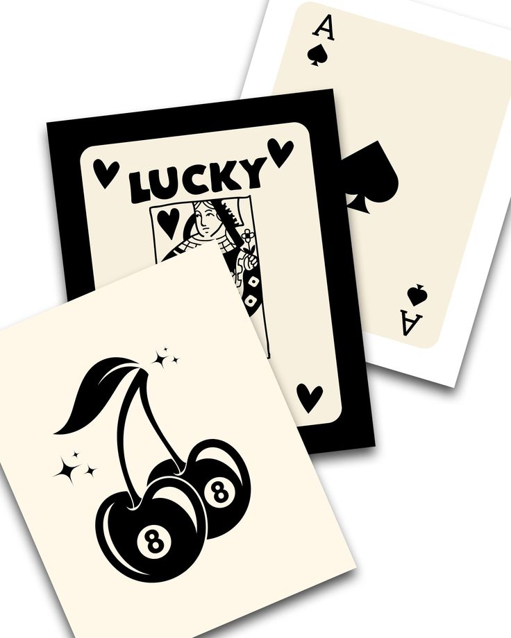 two playing cards with the words lucky written in black and white on them, one has a pair of cherries