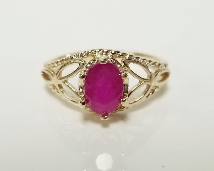 "Thanks for shopping our vintage estate store. We tend to sell well below wholesale and truly hope you enjoy all of our items. Many of the items are one of a kind, so please enjoy scrolling through the pictures and hopefully something will catch your eye. Spots are from reflections or camera. Estate 14k yellow gold natural Serengetti 1ct oval red ruby filigree ring. No scratches on the gem. Stunning. Vintage setting, we added the gem. Size: 6 Setting: 8mm 3/8\" by 6mm 1/4\" Band width: 2mm Weight:  2.63 grams Marked 14k. Gem is stunning." Classic Oval Ruby Ring, Oval Ruby Ring Collectible, Antique Oval Ruby Promise Ring, Heirloom Oval Ruby Ring For Collectors, Heirloom Oval Ruby Ring Collectible, Oval Ruby Ring Stamped 14k For Anniversary, Oval Ruby Ring For Anniversary Stamped 14k, Vintage Oval Ruby Ring Stamped 14k, Vintage Setting