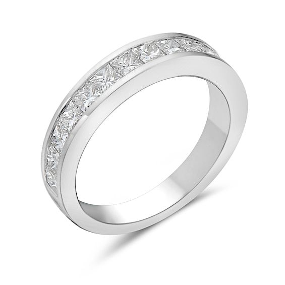 a white gold wedding ring with princess cut diamonds on the side and channel set in the middle