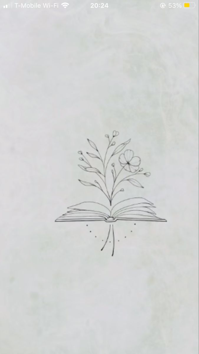 an open book with flowers drawn on it