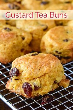 several muffins on a cooling rack with the words custard tea buns