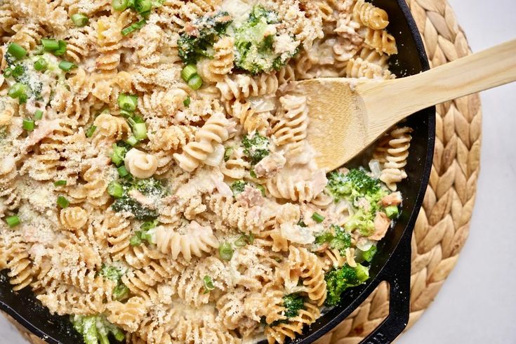 a skillet filled with pasta and broccoli