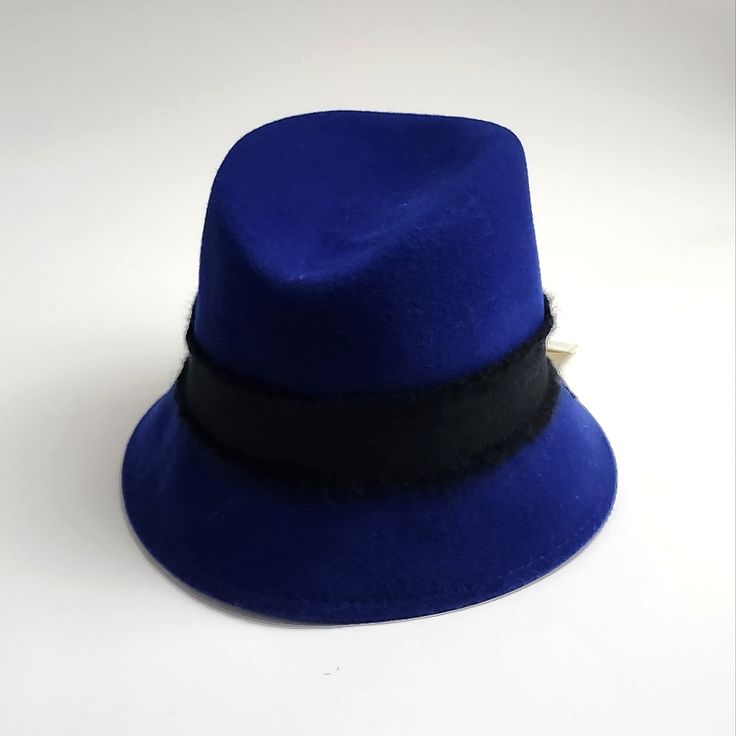 a blue hat with a black band around the brim