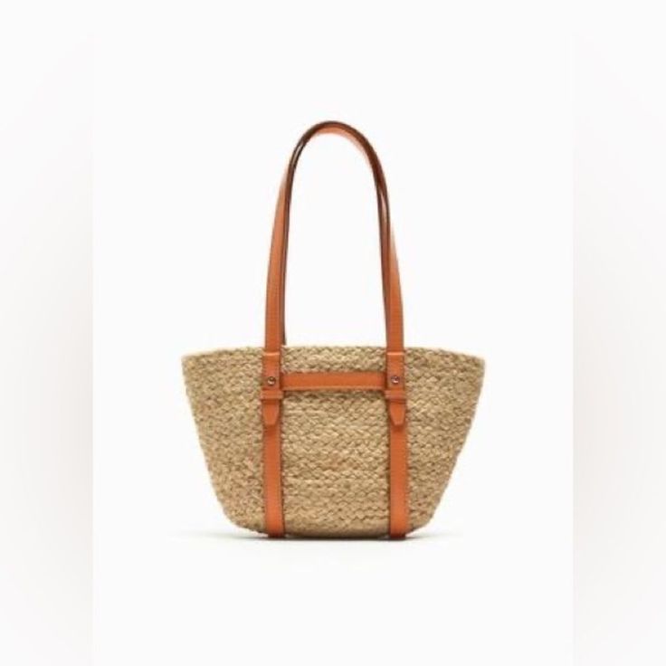 Jute Midi Tote Bag. Shoulder Straps. Height X Length X Width: 16.1 X 12.5 X 3.7 Inches (41 X 31.5 X 9.4 Cm) Beige Straw Bag With Gold-tone Hardware For Shopping, Natural Bags With Gold-tone Hardware For Shopping, Natural Color Bags With Gold-tone Hardware For Shopping, Summer Bucket Bag With Gold-tone Hardware For Shopping, Casual Shopping Bags With Gold-tone Hardware, Natural Color Bucket Bag With Gold-tone Hardware, Summer Shopping Straw Bag With Gold-tone Hardware, Natural Everyday Bags With Gold-tone Hardware, Casual Light Brown Satchel With Leather Handles