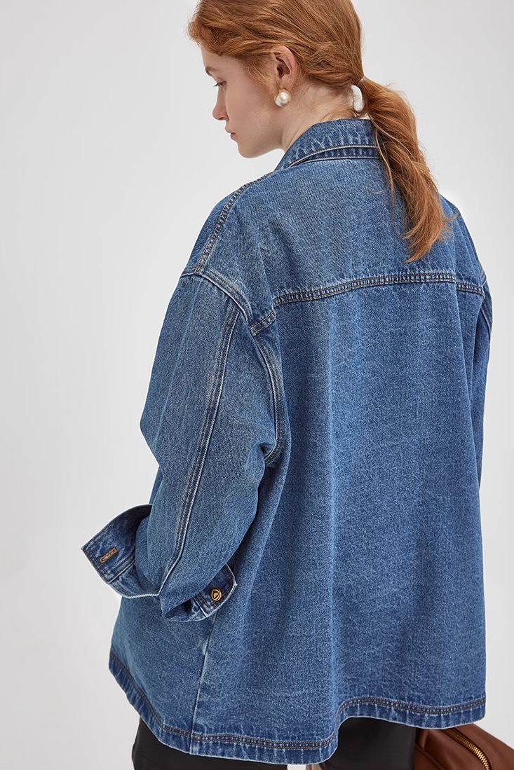 A Versatile, Oversized Jean Jacket for an Elevated Style Elevate your style effortlessly with the Original Trucker Denim Jacket. This oversized jean jacket is the epitome of versatile chic, making it your go-to for any fashionable ensemble. Its contoured collar flatters your neck and face, while dual pockets combine retro flair with practicality. Finished with antique bronze buttons, this blue jean jacket promises a uniquely stylish look. Style #: WWAI414 Oversized Button-up Denim Jacket For Fall, Oversized Washed Denim Outerwear, Oversized Denim Jacket With Button Closure For Everyday, Oversized Denim Shacket With Pockets, Oversized Fall Denim Jacket For Everyday, Oversized Long Sleeve Denim Jacket For Work, Oversized Denim Jacket For Work, Oversized Denim Shacket In Medium Wash, Oversized Medium Wash Denim Shacket