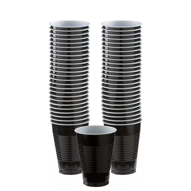 black and white cups stacked on top of each other in front of a white background