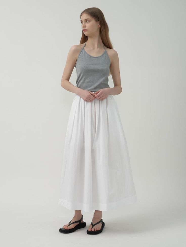 This crisp long skirt is a versatile piece for your wardrobe, made of cotton nylon material with a natural and soft touch after bio-washing.- Comfortable fit with elastic wool waistband- Adjustable inner straps for comfortable wear experience- Convenient side pockets as a refined touch Chic Solid Cotton Maxi Skirt, Cotton Pleated Maxi Skirt For Daywear, Cotton Lined Maxi Skirt For Daywear, Cotton Maxi Skirt With Elastic Waistband For Daywear, Cotton Maxi Skirt For Daywear, Everyday Long Skirt For Spring, Spring Cotton Stretch Maxi Skirt, Cotton Stretch Maxi Skirt, Summer Cotton Stretch Maxi Skirt