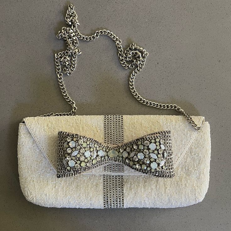 New Designer Genuine Swarovski Crystal 3d Bow And Fully Beaded. Clutch Is Handcrafted By Skilled Artisans. Has Beautiful Long Silver Chain So Clutch Can Be Worn Over The Shoulder. Rare Find. Glamorous Rectangular Hand Embellished Clutch, Chic Beaded Rectangular Clutch, Glamorous Silver Beaded Clutch, Luxury Beaded Rectangular Clutch, Mary Frances Bags, Mary Frances Handbags, Luxury Multicolor Beaded Clutch, Mary Frances, Crystal Clutch