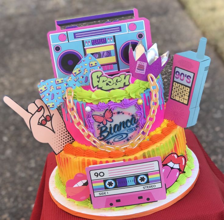 there is a cake made to look like a cassette player and music tape recorders