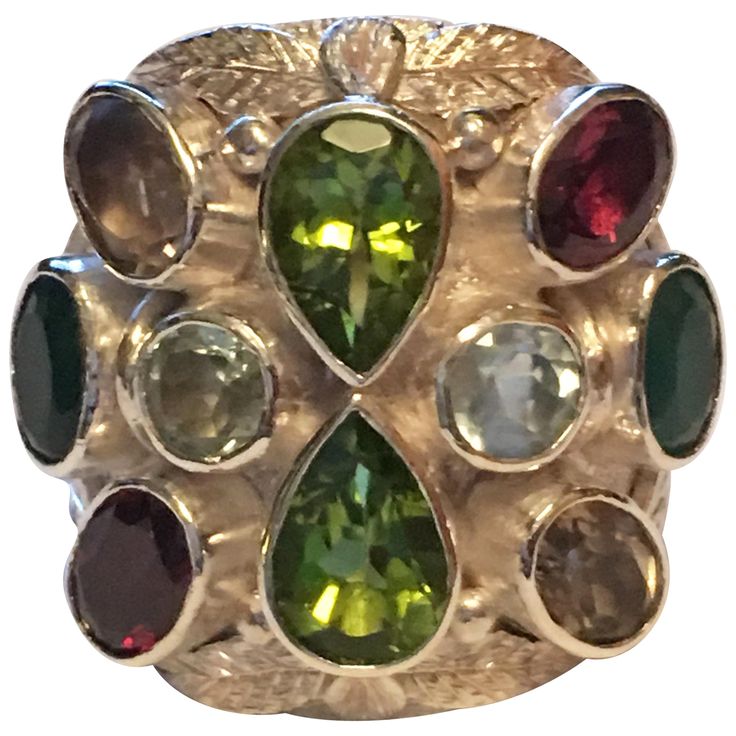 Pears shape Peridot. Oval Garnet, Round aquamarine, Oval Smokey Topaz, and oval Emerald are hand cut and polished . All the stones are natural not heated or treated stones. Hand crafted one of a kind ring IS UNISEX. Total weight is 19.01 Gram. Now 8.5 is size of the ring but can be resized. Smokey Topaz, Handcrafted Rings, Color Stone, Cocktail Rings, Pear Shaped, Aquamarine, Stone Color, Garnet, Topaz